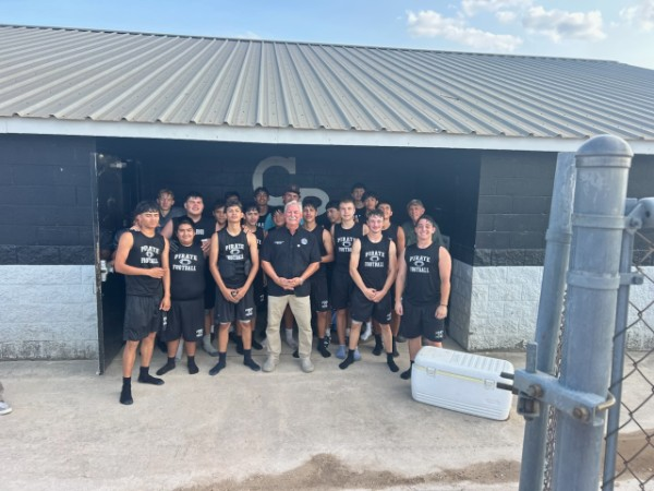 Commissioner Rich Paces with the Center Point High School Pirate football team
